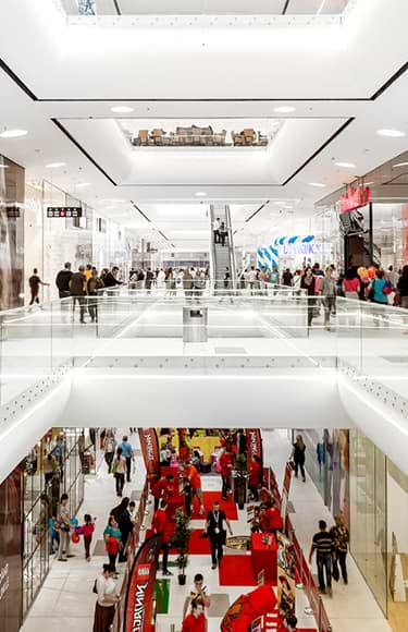 People carrying shopping bags at a mall